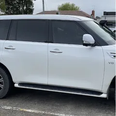 White Nissan Patrol with tinted windows