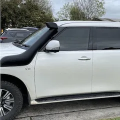 White Nissan Patrol with tinted windows