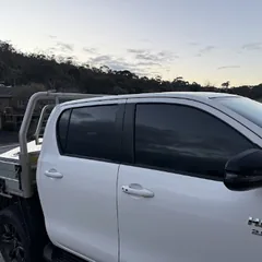 White Toyota Hilux with tinted windows