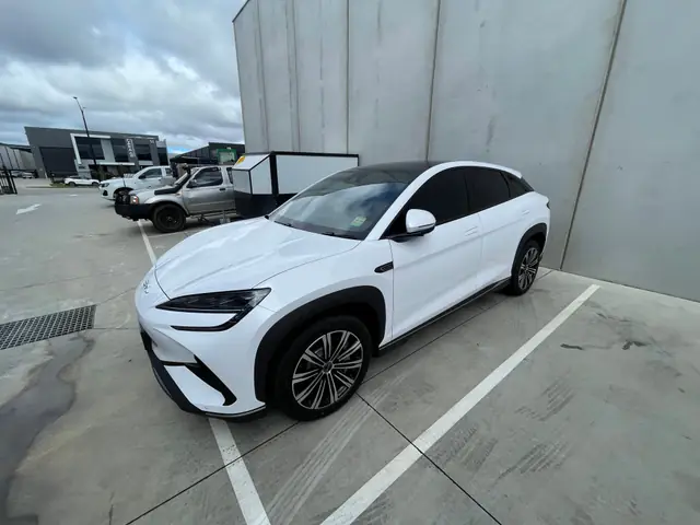 White SUV with tinted windows parked outside
