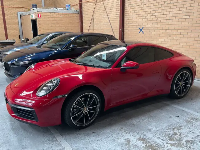 Red Porsche 911 with tinted windows